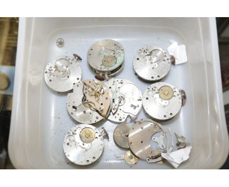 Box containing a selection of bezel wound Aviation clock movements 