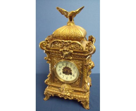 Extremely large brass cased mantel clock crested with figure of an eagle with wings outstretched, striking movement stamped D