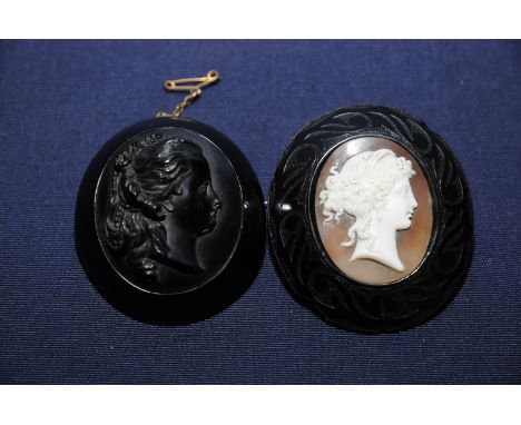Large carved Victorian jet cameo style broach with carved profile of a ladies head portrait and another similar with inset ca