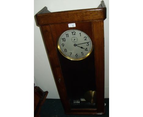 1930s oak cased electric wall clock