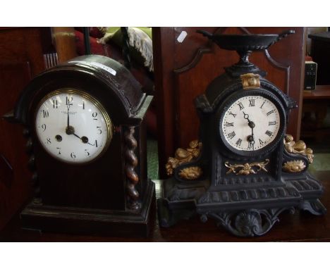 Oak cased mantel clock with barley twist supports by B. Mallinson & Co Huddersfield and a Victorian cast metal cased clock (2