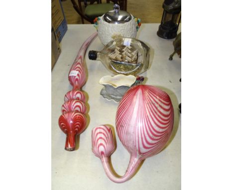 A large Nailsea-style pink and white candy-pink swirl glass ornamental pipe in two sections, 73cm long, a Clarice Cliff 'Celt