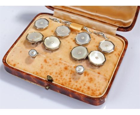 Silver and mother of pearl cuff link and button set, cased in a Moss Bros case