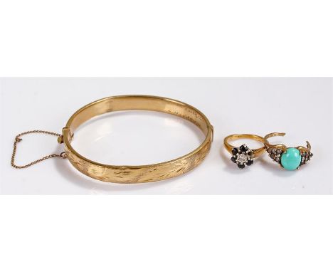 Two stone set rings together with a rolled gold bangle