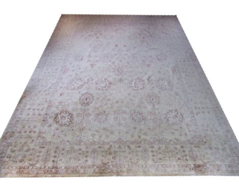 FINE ZIEGLER CARPET, 420cm X 295cm, all over palmette and vine design on an ivory field within corresponding bands and border