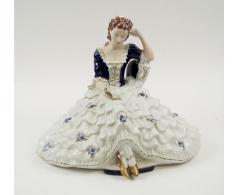 ROYAL DUX, 20th century ceramic, study of a young woman reading a book, 27cm H.
