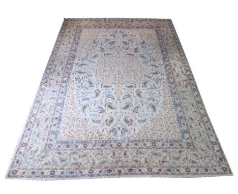 UNUSUAL VINTAGE KASHAN CARPET, 355cm x 233cm, central medallion of scrolling vines on an ivory field of boteh guls within mul