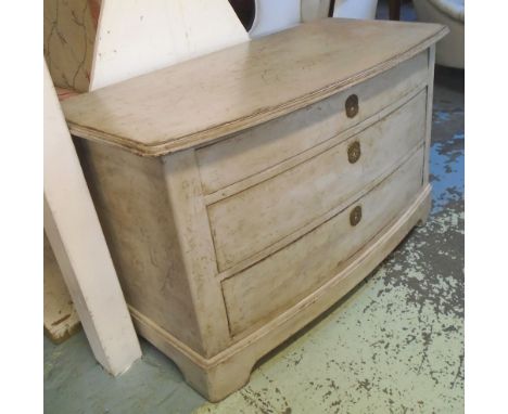 BOWFRONT COMMODE, 19th century Swedish and later distress white painted with three drawers, 71cm H x 117cm x 57cm.