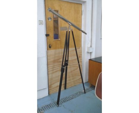 TELESCOPE, in chromed metal on extendable tripod supports, 160cm H.
