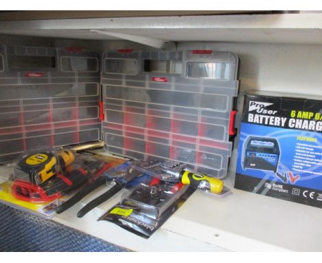 A tool case together with mixed tools to include pliers, a twelve piece tool and pouch set, a battery charger, ratchet screwd
