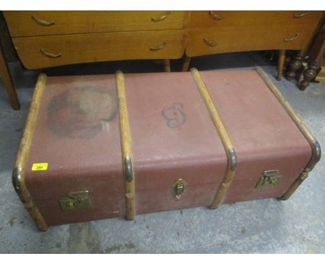 A vintage canvas bound travelling trunk having two leather carrying handles 