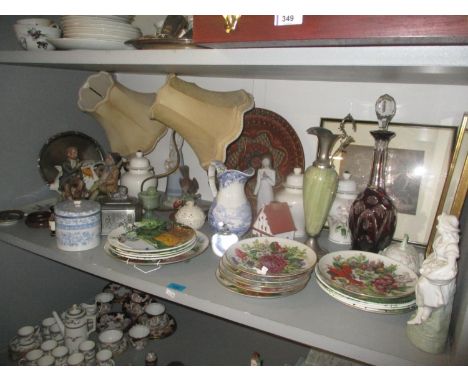 A ruby flashed decanter with stopper together with a mixed lot of collectors plates, framed prints, brass table lamps, a Capo