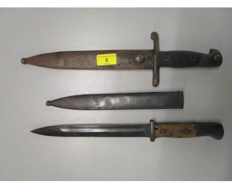 A 1941 Spanish bayonet machete for a Mauser with scabbard, marked F N Taledo 4291.F, blade approx 9 1/2" long, together with 