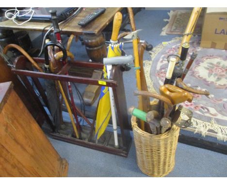 A selection of walking sticks to include one with an antler handle, a 19th century Irish bog oak stick and others Location: S