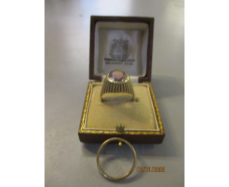 A 9ct gold ring set with one amethyst, together with a 9ct gold wedding band 