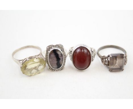 Four silver true vintage stone set rings (21g) 