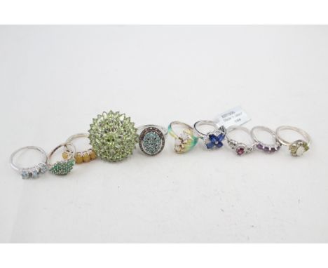 A collection of silver stone set rings including opal and emerald (39g) 