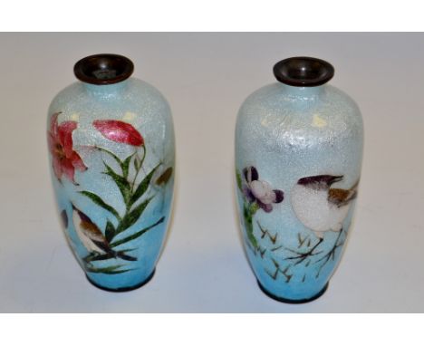 A pair of Japanese enamel baluster vases, decorated with birds and flowers on an ice blue ground, Shōwa Period (faults)