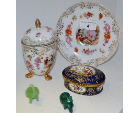 A French oval gilt metal mounted trinket box and cover, decorated with a fanciful bird with a gilt scroll cartouche on a coba