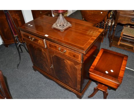 A late 20th Century dining suite comprising sideboard, corner cabinet, dining table, lamp table and eight chairs