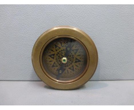 A brass compass marked F. Barker & Sons Ltd. London 1904, with integral magnifying glass. 