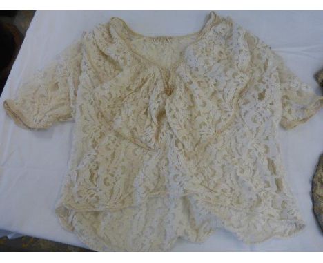 Two negligees: one silk with handmade lace detailing, the other long, black with ivory lace detailing; a short lace top and a
