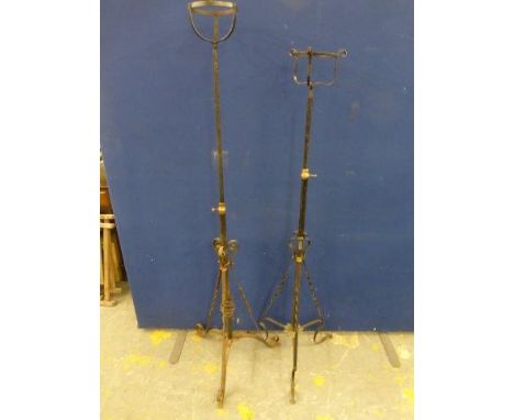 Two Edwardian wrought iron oil lamp stands. 