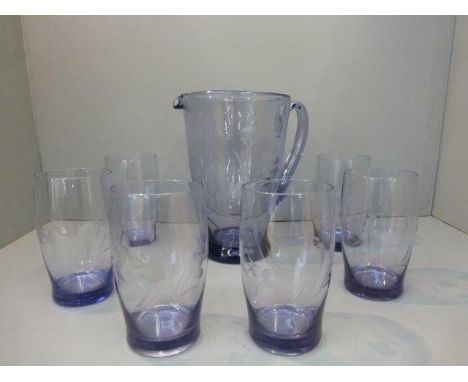 An amethyst glass lemonade set consisting of a jug and six glasses. 