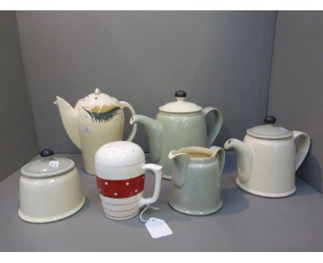 A four piece Denby tea set comprising a teapot, sugar bowl, milk jug and a hot water jug also a sugar sifter and a Susie Coop