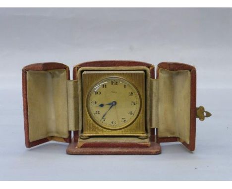 Yesterday's World Museum Antique Shop - a small red leather cased travelling clock, marked to the dial Asprey.