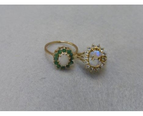 A 9ct gold opal and emerald flower shaped ring, size L and one other ring. 