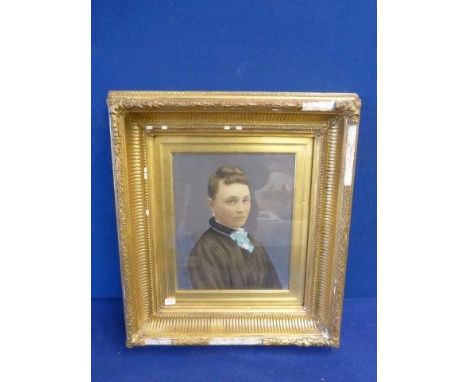 An acrylic on board - portrait of a lady, set within a gilt frame, unsigned.