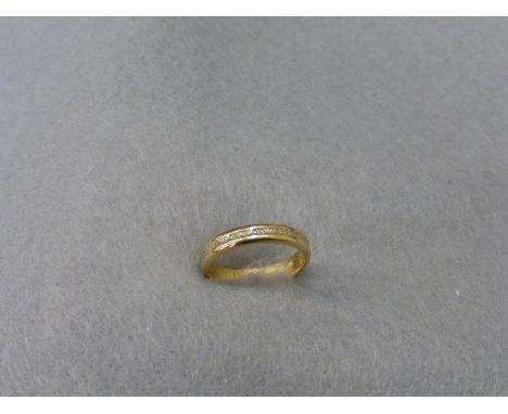 An 18ct gold wedding band, size K. 
