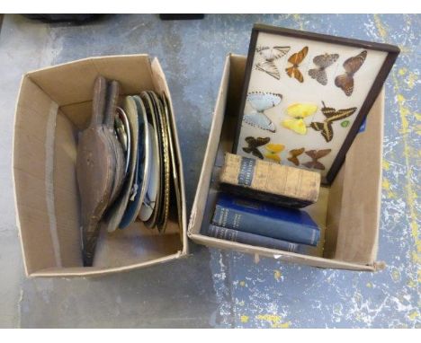 An assortment of ceramic wall chargers, brass wall chargers, two decorative brass framed wall mirrors, a cased set of 12 butt