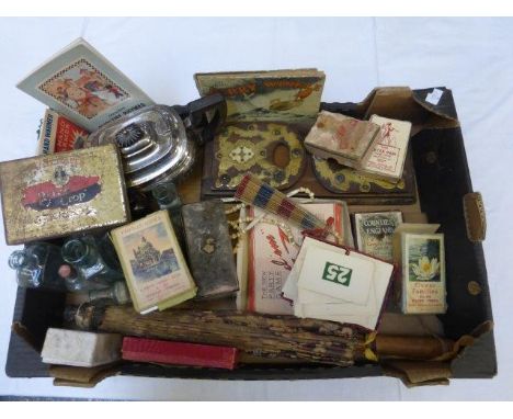 An assortment of mixed collectables to include a brass and ivory decorated book slide, playing cards including a Peter Pan ca