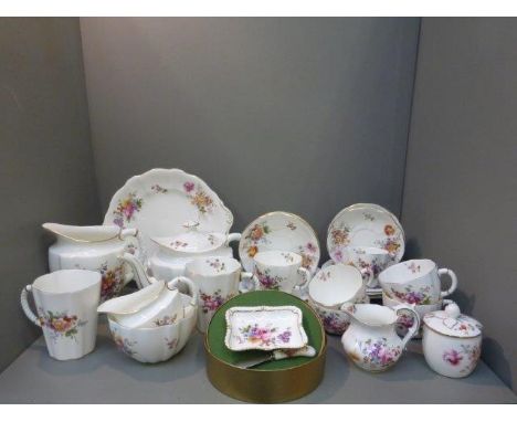 A Royal Crown Derby six setting part tea set in the Derby Posies pattern including a teapot, sucrier, milk jug, side plates e