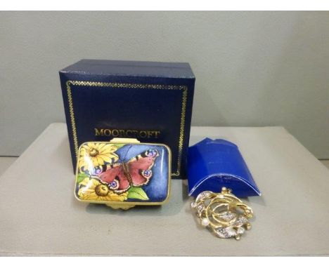 A Moorcroft enamel butterfly lidded trinket box and a Motivex seed pearl brooch. 