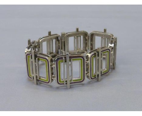 A silver and enamel bracelet. 