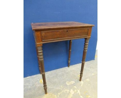 A Regency mahogany single drawer side table raised upon slender ring turned supports. 