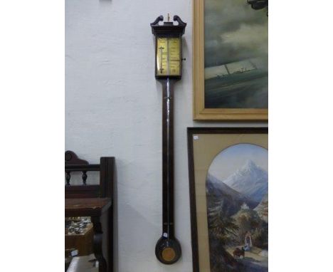 A Thomas Wright inlaid mahogany stick barometer with brass dial. 