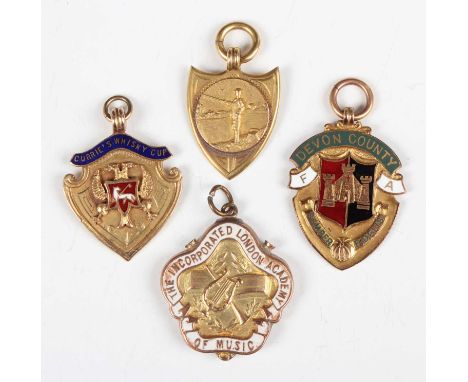 A 9ct gold and white enamelled fob medallion, detailed 'The Incorporated London Academy of Music', Birmingham 1938, cased, tw