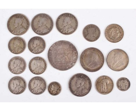 A small collection of 19th and early 20th century world coins, including a Spain silver eight reales or pillar dollar 1756, L
