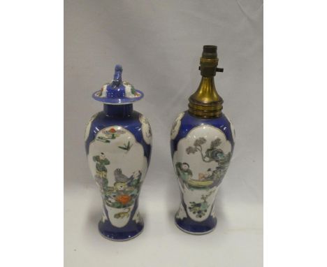 A 19th century Chinese tapered vase and cover with painted figure decoration on blue ground, signed, 13" high together with a