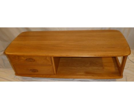 A good quality Ercol light elm rectangular coffee table with two small drawers and under-tier 49" long