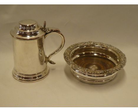 A 19th century Sheffield plate pint sized lidded tankard with scroll handle and a 19th century Sheffield plate bottle stand w