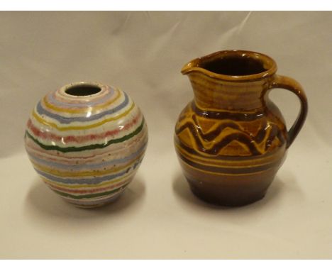 A studio pottery tapered jug by Margaret Leach of Wye Valley Pottery and a studio pottery multi-coloured tapered vase by Chri