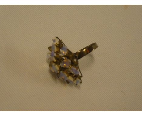 A 9ct gold dress ring set an opal cluster