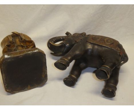 A Chinese bronze figure of a elderly bearded male, 11½" high and an Eastern bronze figure of an elephant (2)