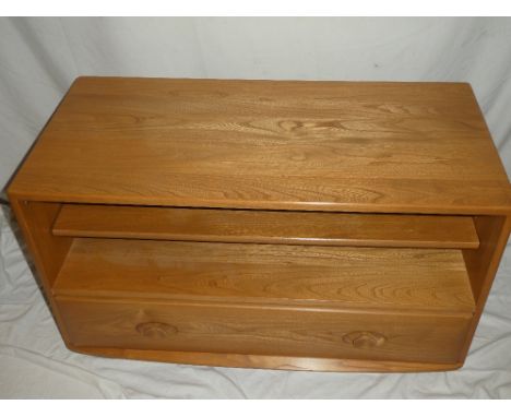 A good quality Ercol light elm rectangular television stand with base drawer and open recess 36" long