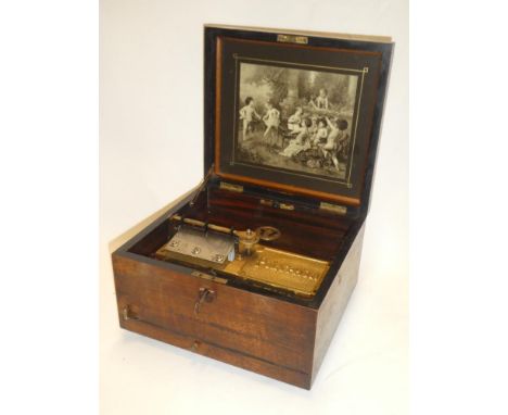 A Victorian polyphon by Nicole Freres with brass mounts in inlaid mahogany square case and a selection of 9" polyphon discs
